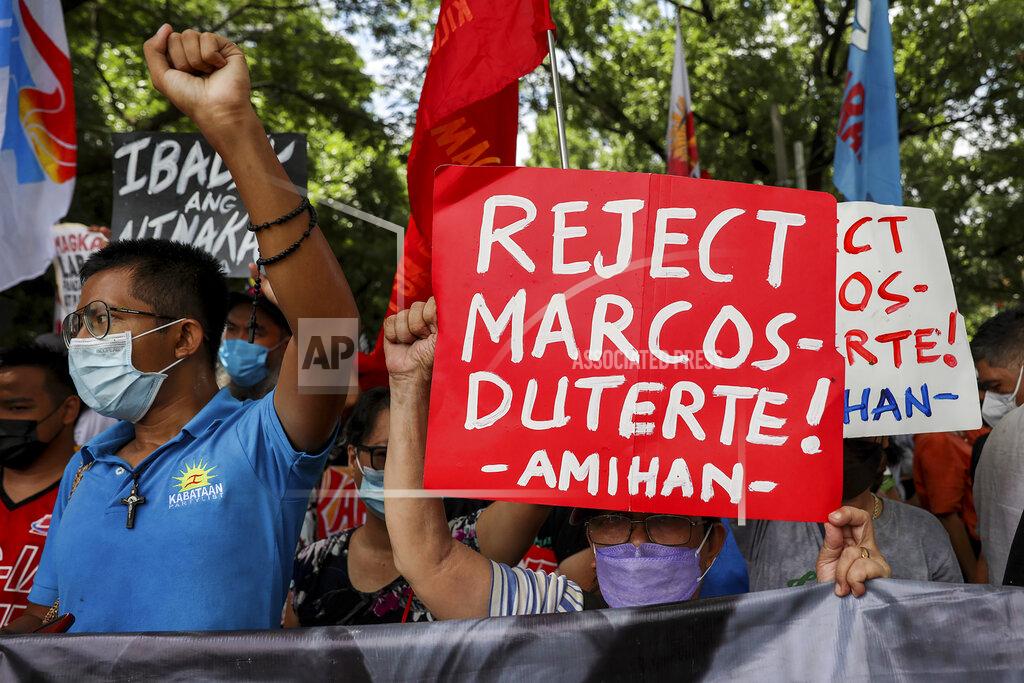Basilio Sepe Activists protest against presidential frontrunner Ferdinand "Bongbong" Marcos and running mate Sara Duterte, daughter of the current president, during a rally at the Commission on Human Rights in Quezon City, Metro Manila, Philippines on Wednesday. May 25, 2022. Marcos Jr. continues to lead in the official canvassing of votes. (AP Photo/Basilio Sepe)