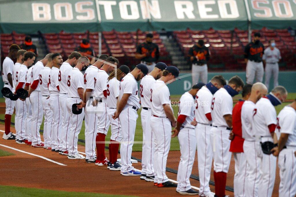 Michael Dwyer The Boston Red Sox and the Baltimore Orioles line up on the base lines during a moment of silence for lives lost to COVID-19, before an opening day baseball game at Fenway Park, Friday, July 24, 2020, in Boston. (AP Photo/Michael Dwyer)