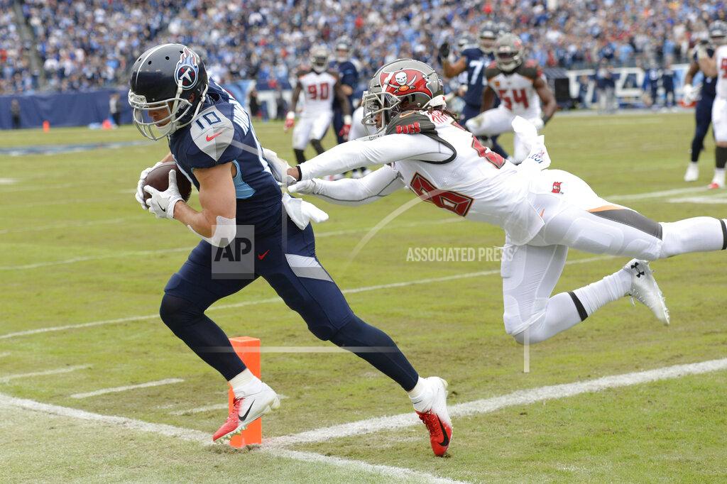 Mark Zaleski Tennessee Titans wide receiver Adam Humphries (10) is pushed out of the end zone by Tampa Bay Buccaneers cornerback Vernon III Hargreaves (28) in the first half of an NFL football game Sunday, Oct. 27, 2019, in Nashville, Tenn. (AP Photo/Mark Zaleski)