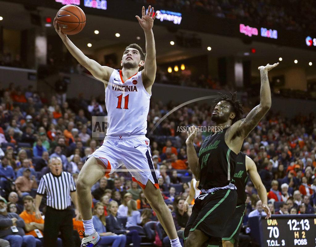 Zack Wajsgras Virginia's guard Ty Jerome (11) shoots past Marshall's C.J. Burks (14) during the second half of an NCAA college basketball game on Monday, Dec. 31, 2018, in Charlottesville, Va. Virginia beat Marshall 100-64. (AP Photo/Zack Wajsgras)