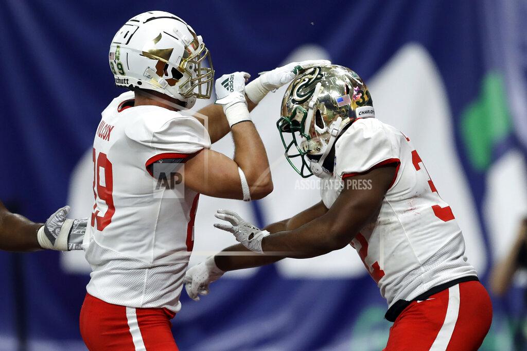Chris O'meara East running back Benny LeMay, of Charlotte, right, celebrates his touchdown against the West with tight end Mitchell Wilcox, of South Florida, (89) during the second half of the East West Shrine football game Saturday, Jan. 18, 2020, in St. Petersburg, Fla. (AP Photo/Chris O'Meara)