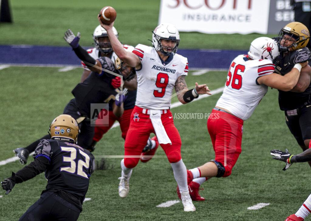 Daniel Lin Richmond quarterback Joe Mancuso (9) fires off a pass under pressure during the second half of an NCAA college football game against James Madison in Harrisonburg, Va., Saturday, April 17, 2021. (Daniel Lin/Daily News-Record Via AP)