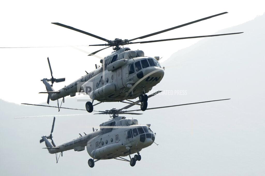 Ng Han Guan United Nations helicopters take art in the Shared Destiny 2021 drill at the Queshan Peacekeeping Operation training base in Queshan County in central China's Henan province Wednesday, Sept. 15, 2021. Peacekeeping troops from China, Thailand, Mongolia and Pakistan took part in the 10 days long exercise that field reconnaissance, armed escort, response to terrorist attacks, medical evacuation and epidemic control. (AP Photo/Ng Han Guan)