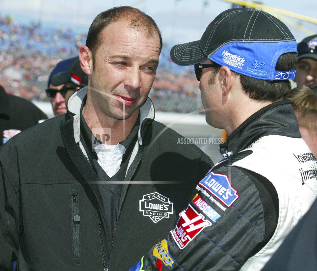 Nigel Cook FILE - In this Feb. 12, 2006, file photo, NASCAR crew chief Chad Knaus, left, and driver Jimmie Johnson talk during qualifying runs at Daytona International Speedway in Daytona Beach, Fla. Knaus got his first big break at Hendrick Motorsports when he was picked to build a team from scratch around a rookie driver who had yet to prove he belonged at NASCAR's top level. The driver was Jimmie Johnson. (Nigel Cook/The Daytona Beach News-Journal via AP)