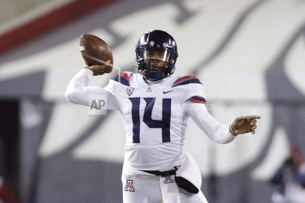 Young Kwak Arizona quarterback Khalil Tate (14) throws a pass during the second half of an NCAA college football game against Washington State in Pullman, Wash., Saturday, Nov. 17, 2018. Washington State won 69-28. (AP Photo/Young Kwak)