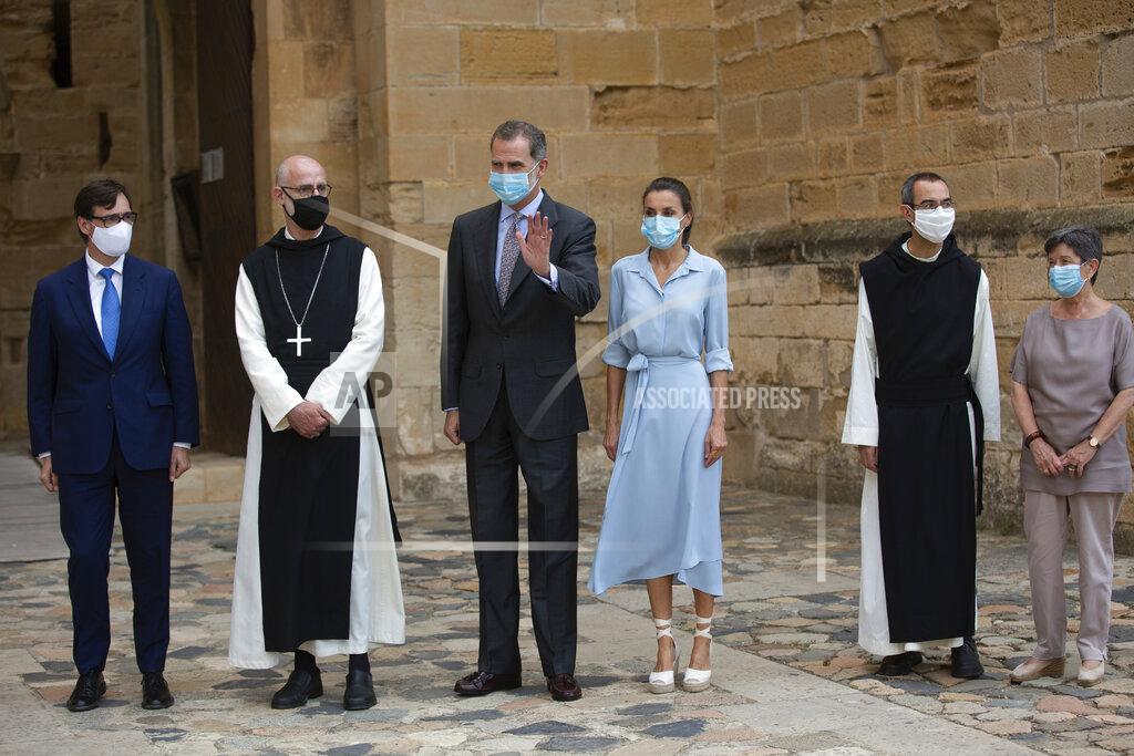 David Zorrakino Spain's Health Minister Salvador Illa, left, Spain's King Felipe VI, third left, and Queen Letizia, third right, visit the Royal Monastery of Poblet, northeastern Spain, Monday, July 20, 2020. Hundreds of Catalan independence supporters are protesting Monday the visit of King Felipe VI and Queen Letizia to the northeastern region as part of a royal tour across Spain that is meant to bolster spirits amid the coronavirus pandemic. The visit comes as a barrage of media leaks have revealed how the king's father, former monarch Juan Carlos I, allegedly hid millions of untaxed euros in offshore funds. (David Zorrakino/Europa Press via AP)