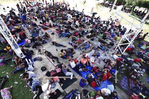 A caravan of migrants, mostly from Central America, heading north, stop to rest in the Alvaro Obregon community, Tapachula municipality, Chiapas state, Mexico, Saturday, Oct. 23, 2021. (AP Photo/Marco Ugarte)