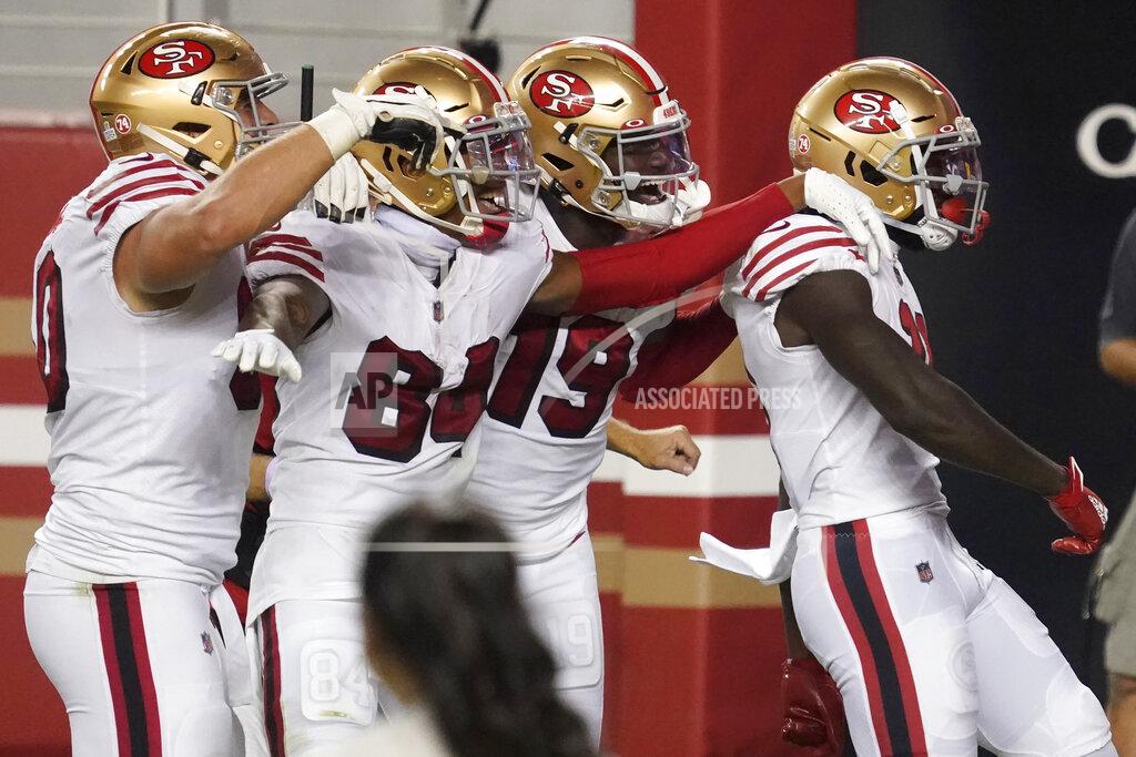 Tony Avelar San Francisco 49ers wide receiver Brandon Aiyuk, right, celebrates with teammates after scoring against the Los Angeles Rams during the first half of an NFL football game in Santa Clara, Calif., Sunday, Oct. 18, 2020. (AP Photo/Tony Avelar)