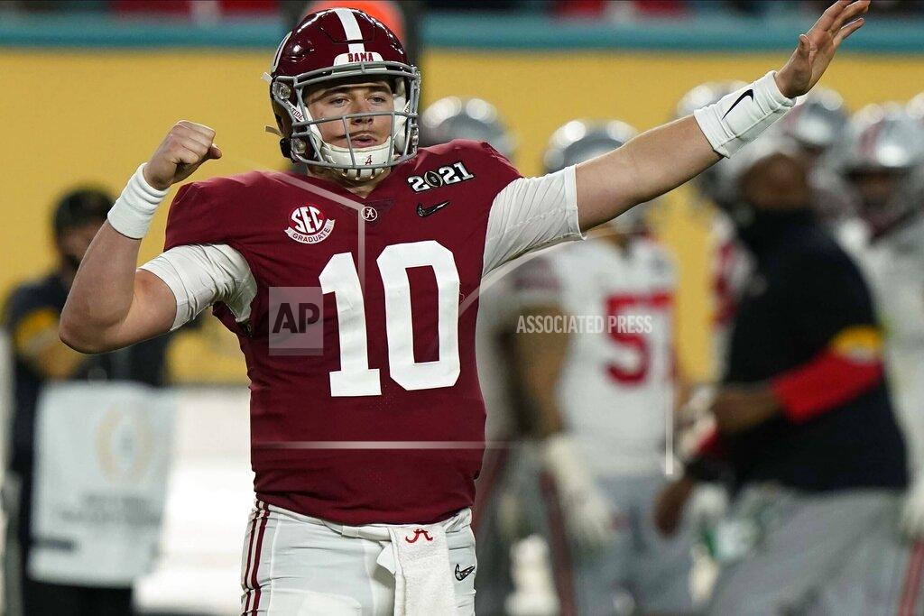 Lynne Sladky FILE - In this Monday, Jan. 11, 2021 file photo, Alabama quarterback Mac Jones celebrates after a touchdown by wide receiver DeVonta Smith during the first half of an NCAA College Football Playoff national championship game against Ohio State in Miami Gardens, Fla. The NFL announced last month that some of the top prospects were being invited to Cleveland. The league is hoping to incorporate some of the city’s best-known locations along Lake Erie: FirstEnergy Stadium, home of the Browns; and the Rock & Roll Hall of Fame. (AP Photo/Lynne Sladky, File)