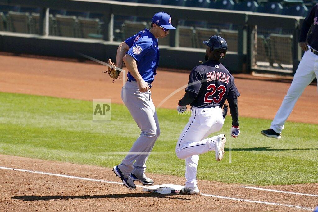 Ross D. Franklin Chicago Cubs first baseman Matt Duffy, left, beats Cleveland Indians' Daniel Johnson (23) to first base for the out during the second inning of a spring training baseball game Thursday, March 18, 2021, in Goodyear, Ariz. (AP Photo/Ross D. Franklin)