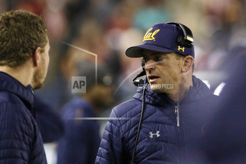 Young Kwak California head coach Justin Wilcox, right, speaks with his staff during the first half of an NCAA college football game against Washington State in Pullman, Wash., Saturday, Nov. 3, 2018. (AP Photo/Young Kwak)