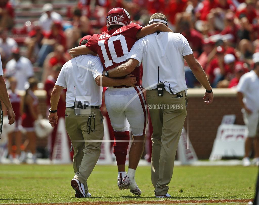 Sue Ogrocki Oklahoma quarterback Austin Kendall (10) is helped off the field after an injury in the second half of an NCAA college football game against Florida Atlantic in Norman, Okla., Saturday, Sept. 1, 2018. (AP Photo/Sue Ogrocki)
