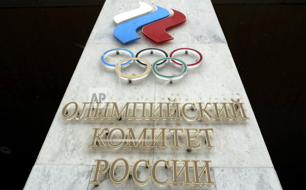 Pavel Golovkin FILE - In this file photo dated Wednesday, Dec. 6, 2017, the logo of the Russian Olympic Committee at the entrance of the head office in Moscow, Russia. The ruling on whether Russia can keep its name and flag for the Olympics will be announced on Thursday Dec. 17, 2020. The Court of Arbitration for Sport said Wednesday that three of its arbitrators held a four-day hearing last month in the dispute between the World Anti-Doping Agency and its Russian affiliate, known as RUSADA. (AP Photo/Pavel Golovkin, File)
