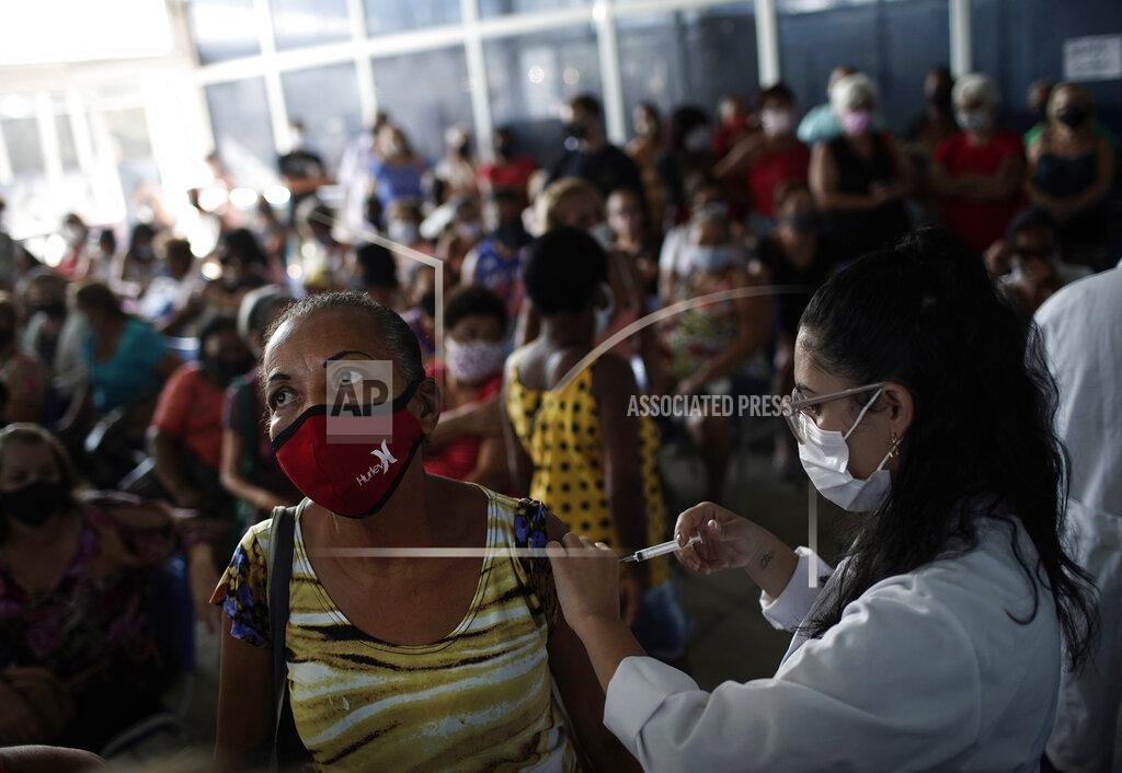 Silvia Izquierdo FILE - In this April 28, 2021 file photo, a healthcare worker injects a woman with a dose of the Sinovac COVID-19 vaccine in Sao Joao de Meriti, Rio de Janeiro state, Brazil. Most nations are short of vaccines, but Brazil's government in particular neglected to chase deals, and just 8.5% of the population is fully vaccinated as of late May 2021. (AP Photo/Silvia Izquierdo, File)
