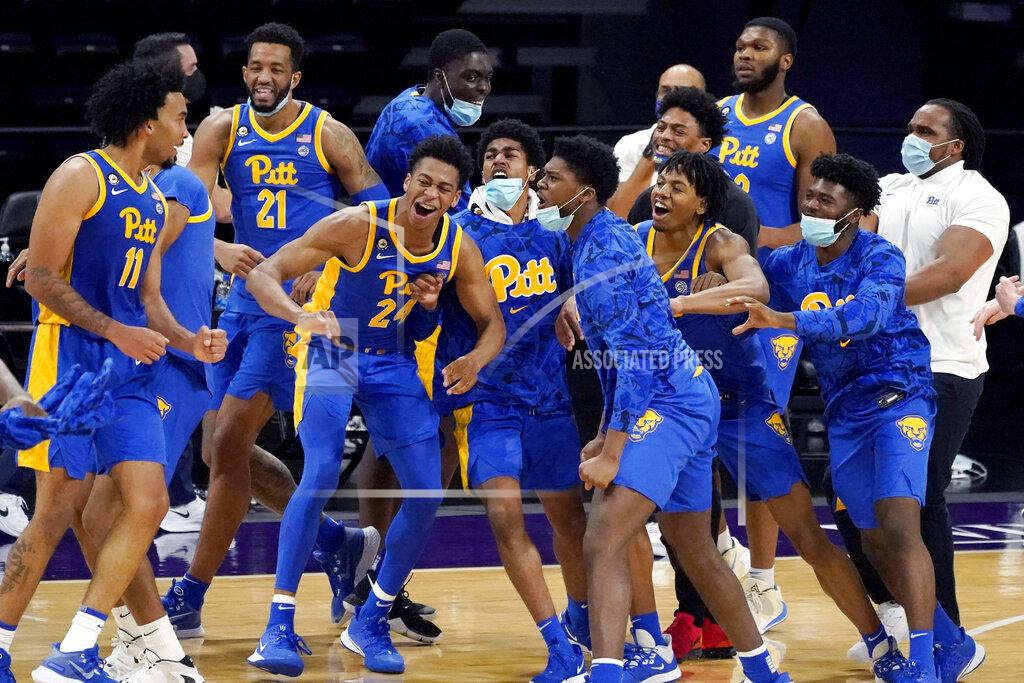 Nam Y. Huh Pittsburgh's Justin Champagnie, left, celebrates with teammates after Pittsburgh win over Northwestern in an NCAA college basketball game in Evanston, Ill., Wednesday, Dec. 9, 2020. (AP Photo/Nam Y. Huh)