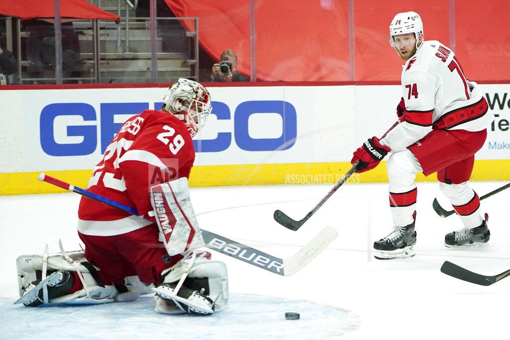Paul Sancya Detroit Red Wings goaltender Thomas Greiss (29) blocks a Carolina Hurricanes' Jaccob Slavin (74) shot in the first period of an NHL hockey game Thursday, Jan. 14, 2021, in Detroit. (AP Photo/Paul Sancya)