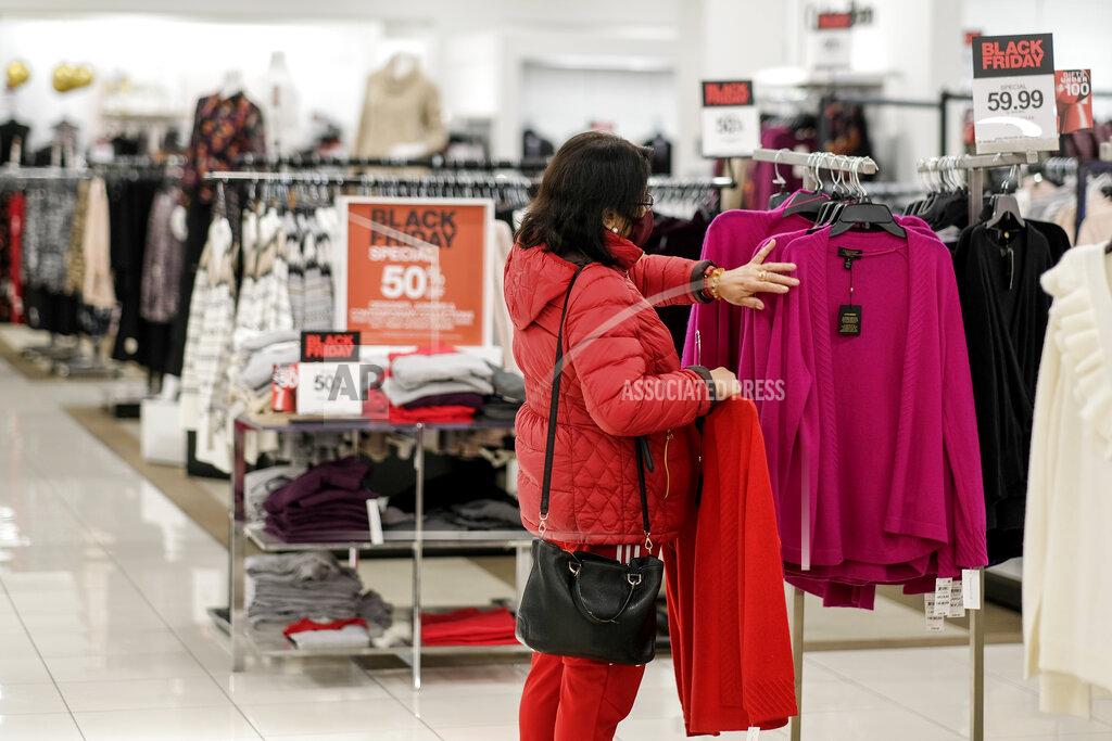 Ringo H.w. Chiu A Black Friday shopper wearing a face mask shops at the Glendale Galleria in Glendale, Calif., Friday, Nov. 27, 2020. (AP Photo/Ringo H.W. Chiu)