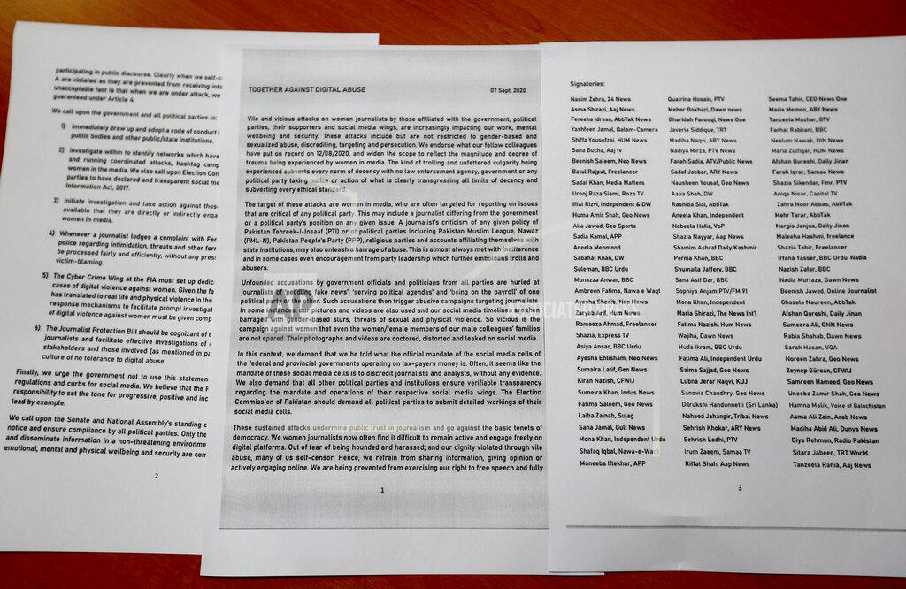 Anjum Naveed A copy of a petition with more than 100 signatures of women journalists, which was given to the government last month demanding an end to the online assaults, is seen in Islamabad, Pakistan, Friday, Sept. 18, 2020. Social media attacks against Pakistan's women journalists have been vile and vicious, some threatening rape, others even threatening death and the culprits are most often allied to the ruling party, even prompting the Committee to Protect Journalists to issue a statement on Friday condemning the relentless attacks. (AP Photo/Anjum Naveed)