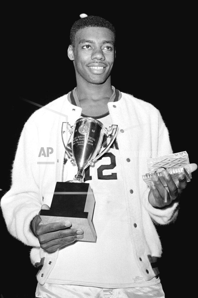 Anonymous FILE - In this Dec. 30, 1959, file photo, Cincinnati's Oscar Robertson poses with the Most Valuable Player award after leading his team to the ECAC Holiday Festival Championship at New York's Madison Square Garden. Cincinnati defeated Iowa 96-83. Four of the top five tournament triple-doubles pre-1986 belong to Robertson. (AP Photo/File)