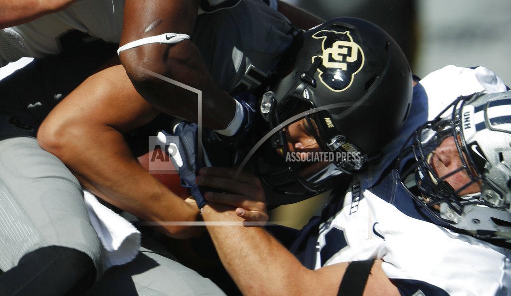 David Zalubowski New Hampshire defensive tackle Ryan Sosnak, right, sacks Colorado quarterback Steven Montez in the first half of an NCAA college football game, Saturday, Sept. 15, 2018, in Boulder, Colo. (AP Photo/David Zalubowski)