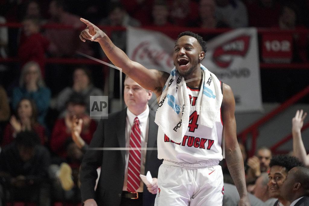 Tim Broekema Western Kentucky guard Josh Anderson (4) points toward guard Taveion Hollingsworth, who scored a 3-pointer during the second half of an NCAA college basketball game against Wisconsin, Saturday, Dec. 29, 2018, in Bowling Green, Ky. (AP Photo/Tim Broekema)