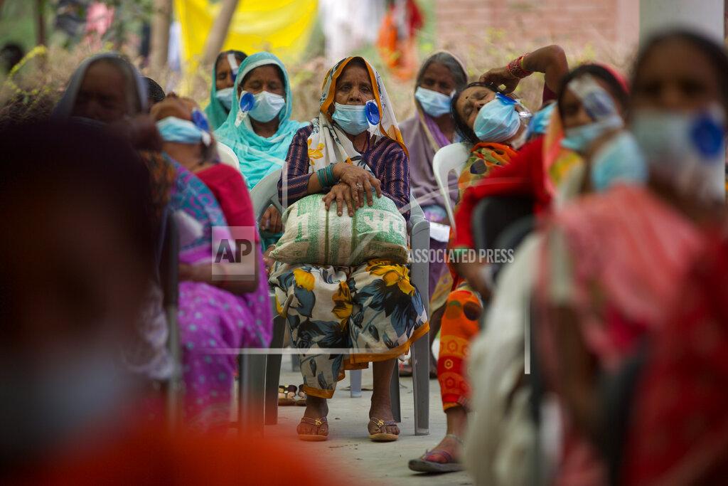 Bikram Rai Nepalese patients wait for their follow up after cataract surgery with Dr. Sanduk Ruit at an eye camp in Lumbini, 288 kilometers (180 miles) south west of Kathmandu, Nepal, March 31, 2021. Nepal’s “God of Sight” eye doctor renowned for his innovative and inexpensive cataract surgery for the poor is taking his work beyond the Himalayan mountains to other parts of the world so there is no more unnecessary blindness in the world. Ruit, who has won many awards for his work and performed some 130,000 cataract surgery in the past three decades, is aiming to expand his work beyond the borders of his home country and the region to go globally. (AP Photo/Bikram Rai)