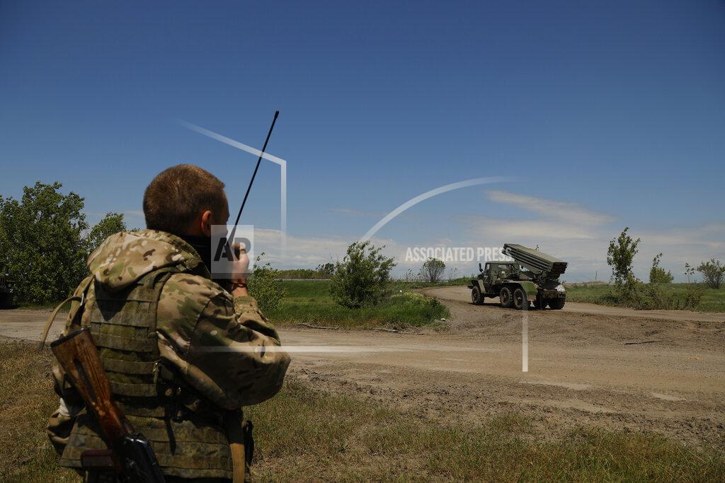 Alexei Alexandrov A Donetsk People's Republic militia serviceman speak on a communication device prior to fire with a multiple rocket launcher from its position not far from Panteleimonivka, in territory under the government of the Donetsk People's Republic, eastern Ukraine, Saturday, May 28, 2022. (AP Photo/Alexei Alexandrov)