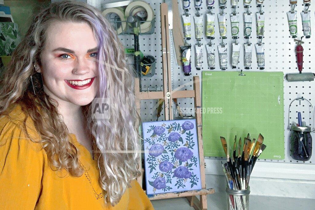 This April 5, 2020, photo provided by Lauren Boisvert shows Boisvert Manchester, N.H. Boisvert, who had been working at a paint bar and as a substitute teacher for two schools while also finishing her senior year at the Institute of Art and Design at New England College, applied for unemployment benefits after going from three jobs to zero. The state has seen more unemployment claims in the past three weeks due to the virus pandemic. (Lauren Boisvert via AP)