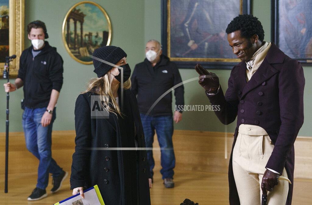 Ross Ferguson This image released by Bleecker Street shows Ṣọpẹ́ Dìrísù, right, and director Emma Holly Jones on the set of "Mr. Malcolm's List." (Ross Ferguson/Bleecker Street via AP)