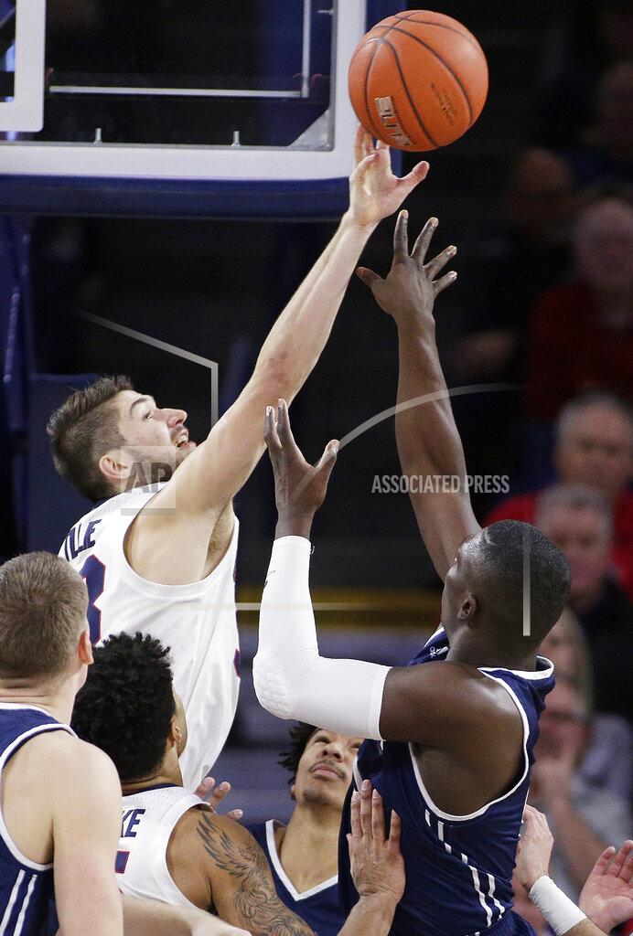 Young Kwak Gonzaga forward Killian Tillie, left, blocks a shot by Loyola Marymount forward Eli Scott during the second half of an NCAA college basketball game in Spokane, Wash., Thursday, Jan. 17, 2019. Gonzaga won 73-55. (AP Photo/Young Kwak)