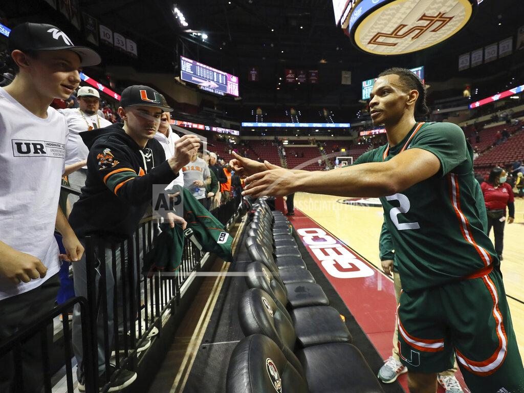 Phil Sears Miami guard Isaiah Wong (2) signs a jersey for a fan after an NCAA college basketball game against Florida State in Tallahassee, Fla., Tuesday, Jan. 24, 2023. (AP Photo/Phil Sears)