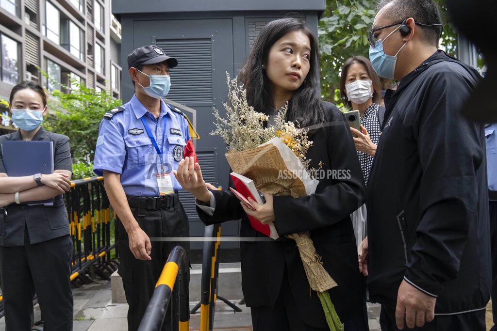 Mark Schiefelbein Zhou Xiaoxuan, a former intern at China's state broadcaster CCTV, has her identification checked at a barricade outside a courthouse in Beijing, Tuesday, Sept. 14, 2021. Zhou became the face of the country's MeToo movement after going public with accusations against a prominent CCTV host in 2018. Since then, even as the movement was shut down by authorities, Zhou has continued to speak out. (AP Photo/Mark Schiefelbein)