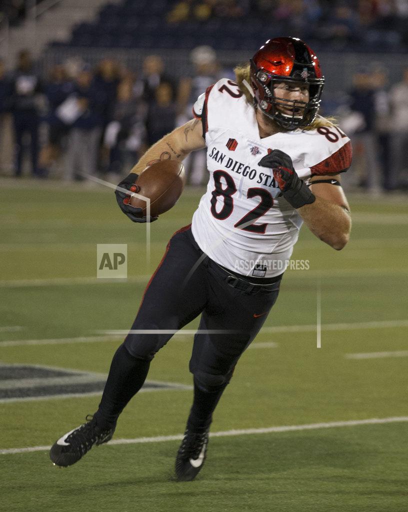 Tom R. Smedes San Diego State's Parker Houston (82) runs after making a catch against Nevada in the first half of an NCAA college football game in Reno, Nev., Saturday, Oct. 27, 2018. (AP Photo/Tom R. Smedes)