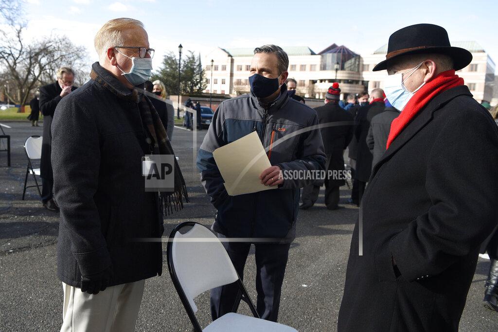 Jessica Hill Mark Boughton, commissioner of the Department of Revenue Services, left, talks Democratic Senate Majority Leader Bob Duff, D-Norwalk, center, and Senate President Pro Tempore Martin Looney, D-New Haven, right, outside on the State Capitol grounds, Wednesday, Jan. 6, 2021, in Hartford, Conn. The new legislative session is expected to focus on the continuing coronavirus pandemic and the state's budget challenges. (AP Photo/Jessica Hill)