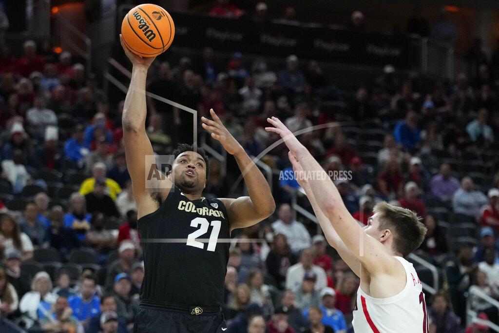 John Locher Colorado's Evan Battey (21) shoots against Arizona during the second half of an NCAA college basketball game in the semifinal round of the Pac-12 tournament Friday, March 11, 2022, in Las Vegas. (AP Photo/John Locher)