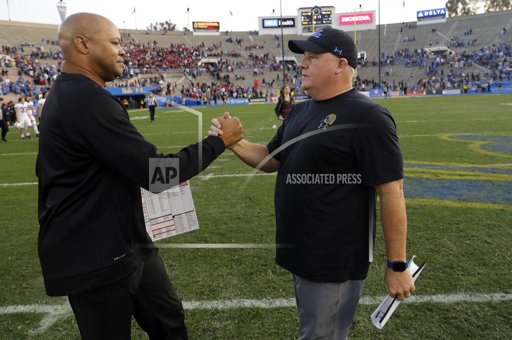 Marcio Jose Sanchez Stanford head coach David Shaw, left, shakes hands with UCLA head coach Chip Kelly after Stanford's 49-42 win during an NCAA college football game Saturday, Nov. 24, 2018, in Pasadena, Calif. (AP Photo/Marcio Jose Sanchez)