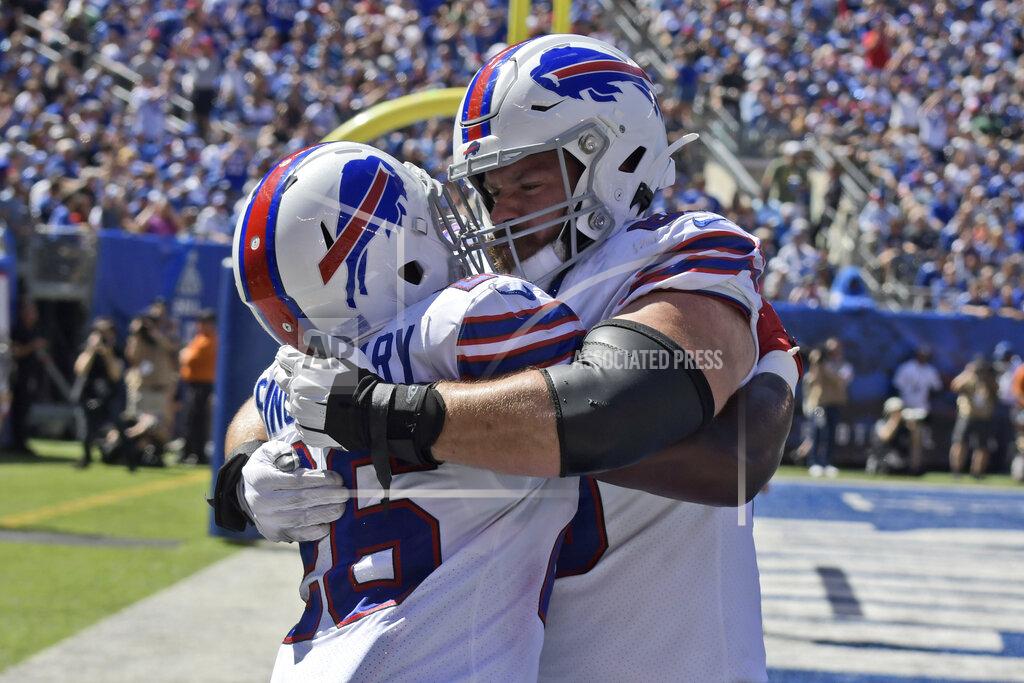 Bill Kostroun Buffalo Bills' Devin Singletary, left celebrates his touchdown with Mitch Morse during the first half of an NFL football game against the New York Giants, Sunday, Sept. 15, 2019, in East Rutherford, N.J. (AP Photo/Bill Kostroun)