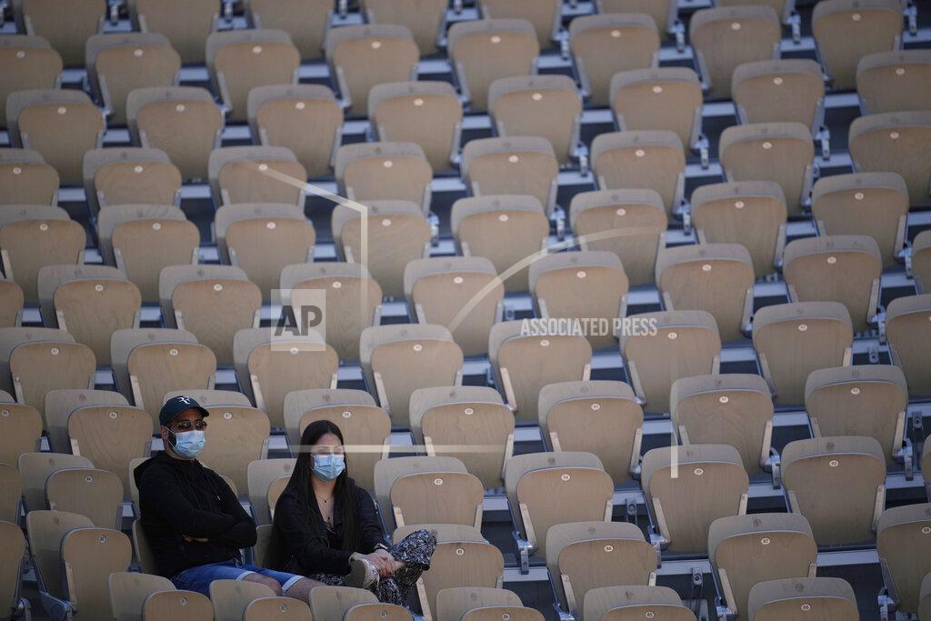 Christophe Ena Spectators watch Austria's Dominic Thiem playing Spain's Pablo Andujar during their first round match of the French Open tennis tournament at the Roland Garros stadium Sunday, May 30, 2021 in Paris. (AP Photo/Christophe Ena)