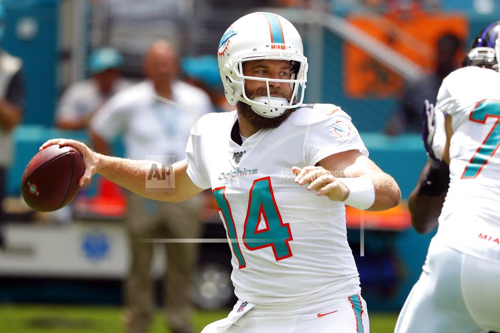 Wilfredo Lee FILE - In this Sunday, Sept. 8, 2019, file photo, Miami Dolphins quarterback Ryan Fitzpatrick (14) looks to pass, during the first half at an NFL football game against the Baltimore Ravens, in Miami Gardens, Fla. Fitzpatrick has been in the NFL so long his oldest sons are now 12 and 10. After games, they want to talk with him mostly about fantasy football.
(AP Photo/Wilfredo Lee, File)
