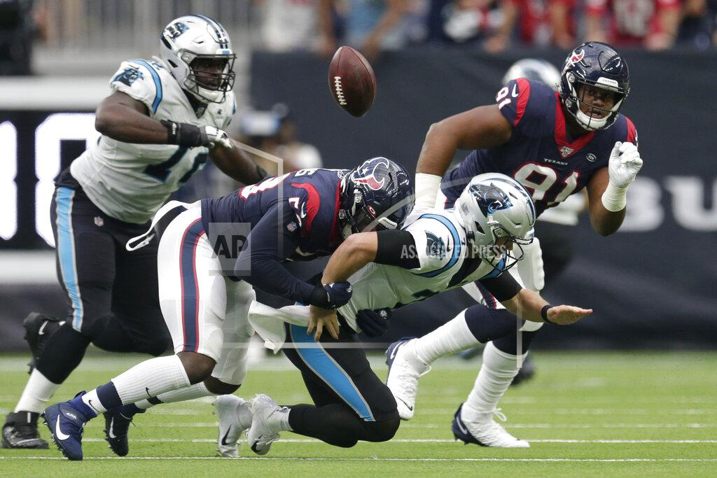 Michael Wyke Carolina Panthers quarterback Kyle Allen (7) fumbles as he is hit by Houston Texans outside linebacker Whitney Mercilus (59) during the first half of an NFL football game Sunday, Sept. 29, 2019, in Houston. (AP Photo/Michael Wyke)