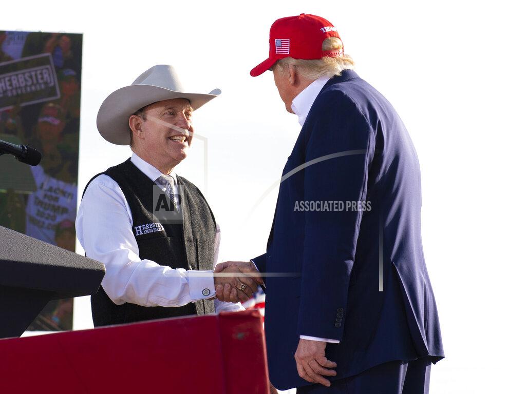 Kenneth Ferriera FILE - Nebraska Republican gubernatorial candidate Charles Herbster, left, shakes hands with former President Donald Trump during a campaign rally for Herbster, May 1, 2022, in Greenwood, Neb. In Nebraska's Republican primary for governor, Trump has endorsed Herbster, a wealthy agribusinessman and cattle breeder who has positioned himself as a political outsider. (Kenneth Ferriera/Lincoln Journal Star via AP, File)