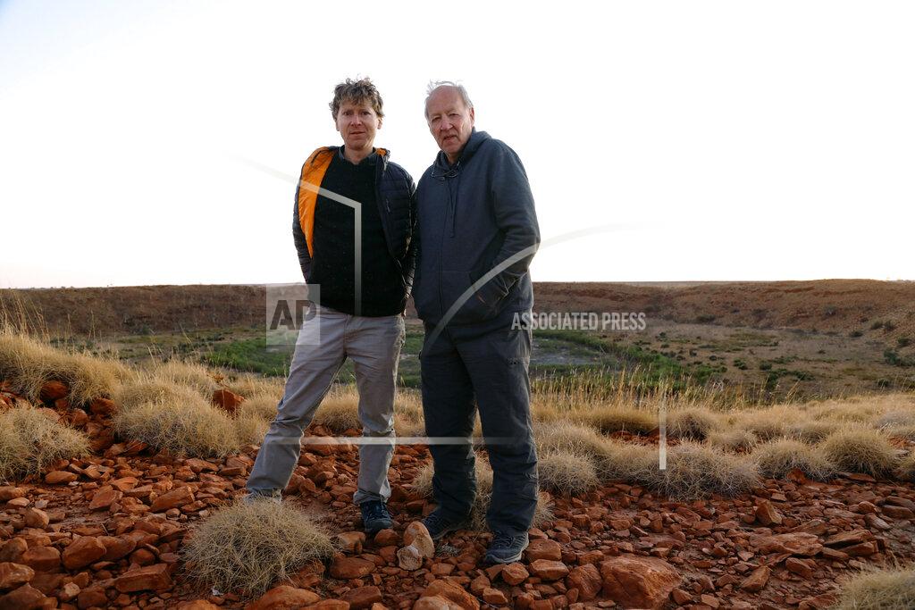 Uncredited This image released by Apple shows filmmakers Clive Oppenheimer, left, and Werner Herzog behind the scenes of “Fireball: Visitors From Darker Worlds,” a documentary about meteors and comets, premiering globally on Apple TV+ on November 13. (Apple via AP)