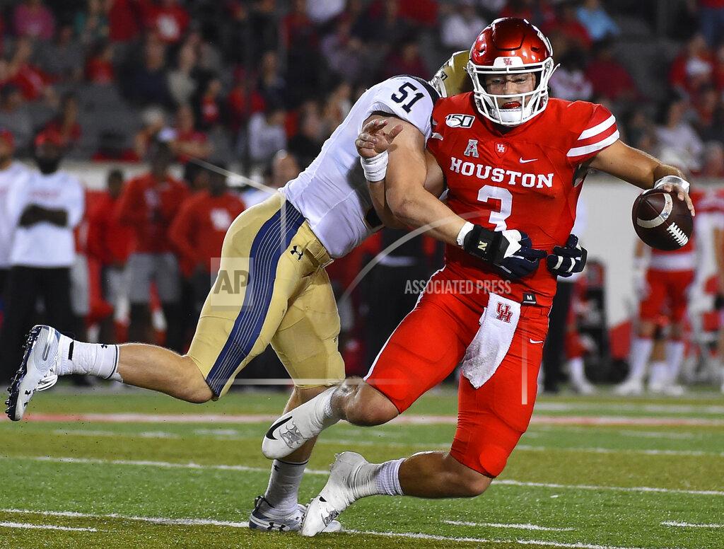 Eric Christian Smith Houston quarterback Clayton Tune (3) is sacked by Navy linebacker Paul Carothers during the first half of an NCAA college football game, Saturday, Nov. 30, 2019, in Houston. (AP Photo/Eric Christian Smith)
