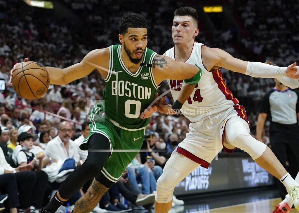 Lynne Sladky Boston Celtics forward Jayson Tatum (0) dribbles the ball as Miami Heat guard Tyler Herro (14) defends during the first half of Game 2 of the NBA basketball Eastern Conference finals playoff series, Thursday, May 19, 2022, in Miami. (AP Photo/Lynne Sladky)