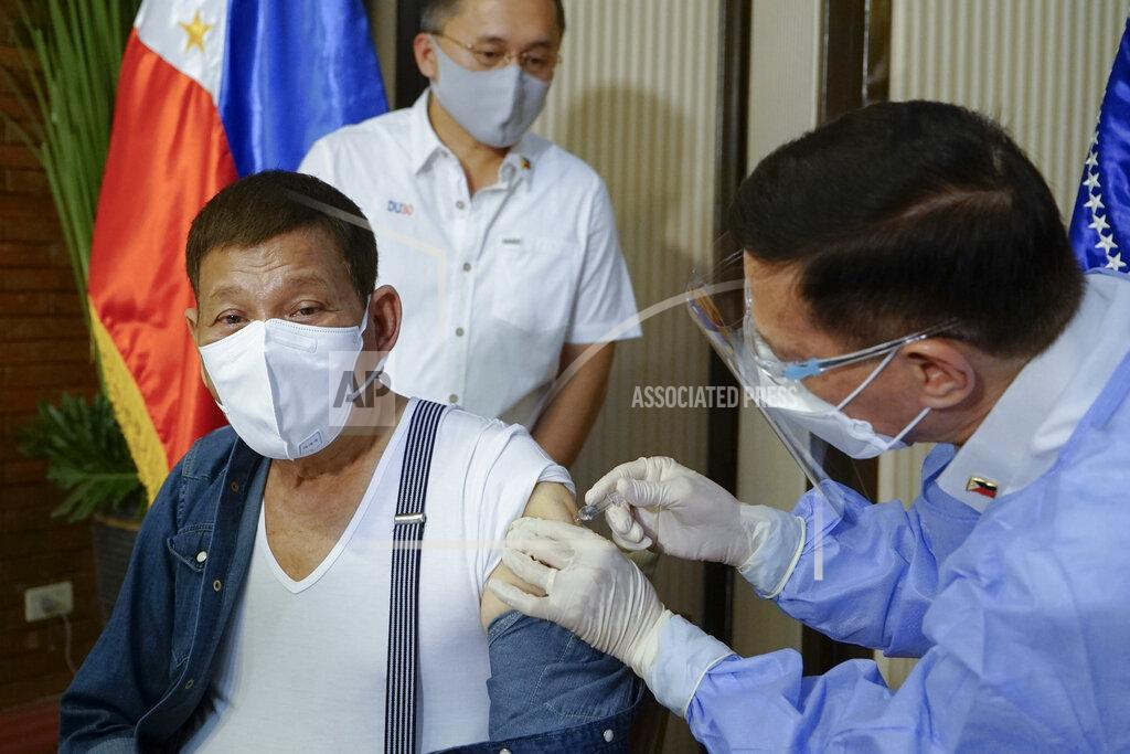 King Rodriguez In this photo provided by the Malacanang Presidential Photographers Division, Philippine President Rodrigo Duterte, left, is inoculated with China's Sinopharm COVID-19 vaccine by Health Secretary Fracisco Duque III at the Malacanang presidential palace in Manila, Philippines Monday, May 3, 2021. The Philippine president has asked China to get back 1,000 doses of donated Sinopharm vaccine after facing criticisms for allowing himself to be injected with it although it has not yet been authorized for public use in the country. (King Rodriguez/Malacanang Presidential Photographers Division via AP)