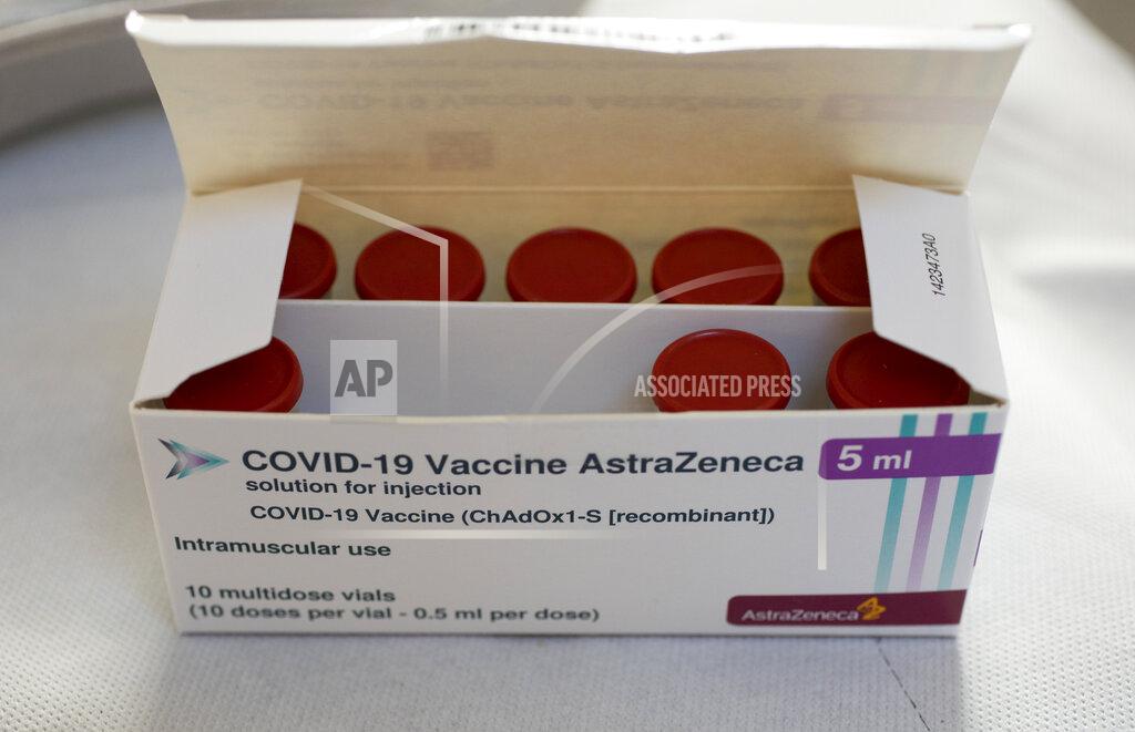 Peter Dejong FILE - In this Wednesday, April 14, 2021 file photo, a box with vials of AstraZeneca vaccine against COVID-19 were taken out of a fridge for a few seconds during a vaccination campaign in Amsterdam, Netherlands. The European Commission will try this week to persuade a Belgian court to order the AstraZeneca pharmaceutical company to deliver millions of doses of its COVID-19 vaccines to EU countries. The EU accuses the Anglo-Swedish drugmaker of failing to deliver the number of shots it agreed. AstraZeneca’s contract signed with the Commission on behalf of all 27 EU member states foresaw an initial 300 million doses for distribution among member countries, with an option for a further 100 million. The doses were expected to be delivered throughout 2021 but only 30 million were sent during the first quarter. (AP Photo/Peter Dejong, File)