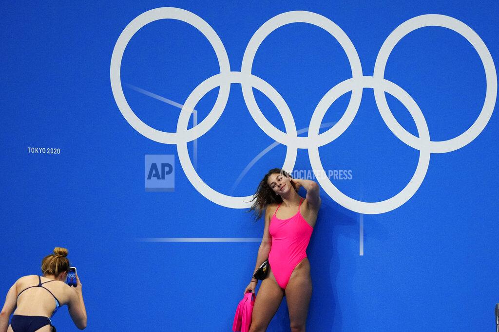 Matthias Schrader Hannah Kuechler, of Germany, poses for photos at the Olympic rings prior to a swimming practice session at the Tokyo Aquatics Center at the 2020 Summer Olympics, Thursday, July 22, 2021, in Tokyo, Japan. (AP Photo/Matthias Schrader)