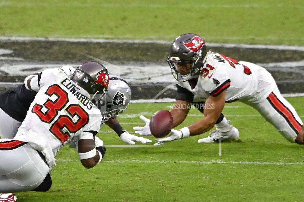 David Becker Tampa Bay Buccaneers strong safety Antoine Winfield Jr. (31) makes an interception against the Las Vegas Raiders during the second half of an NFL football game, Sunday, Oct. 25, 2020, in Las Vegas. (AP Photo/David Becker)