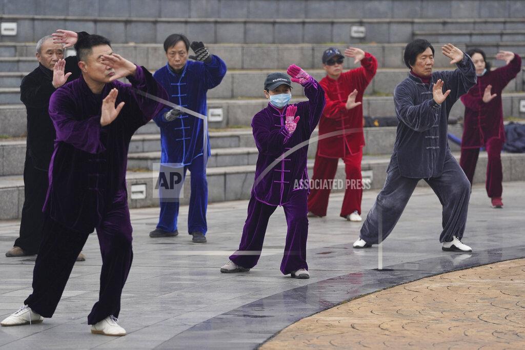 Residents practice tai chi at a park in Wuhan in central China's Hubei Province on Saturday, Jan. 23, 2021. A year after it was locked down to contain the spread of coronavirus, the central Chinese city of Wuhan has largely returned to normal, even as China continues to battle outbreaks elsewhere in the country. (AP Photo/Ng Han Guan)