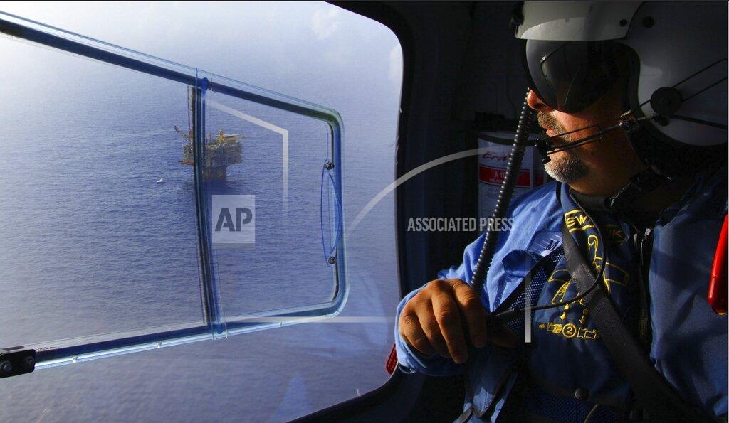 Uncredited In this undated photo, released by the U.S. Bureau of Safety and Environmental Enforcement, an inspector with the U.S. Bureau of Safety and Environmental Enforcement is seen surveying the Gulf of Mexico for pollution. Since the 2010 Deepwater Horizon oil spill companies have been drilling in deeper and deeper waters. (U.S. Bureau of Safety and Environmental Enforcement via AP)
